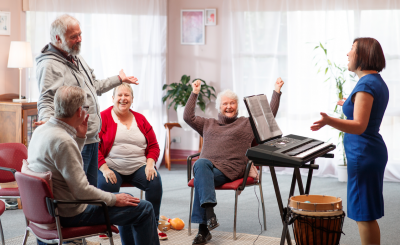 Image of music therapist working with elderly people.