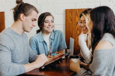 Young people talking in a cafe