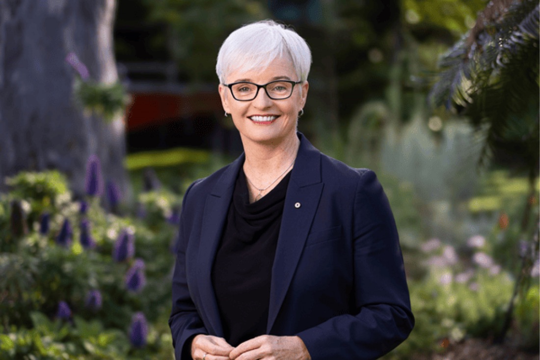 Vice Chancellor Emma Johnston has grey hair and is wearing a navy suit