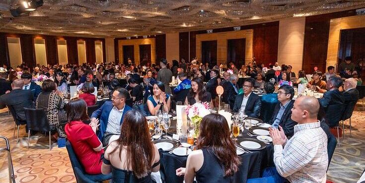 A large group of alumni mingling at a Malaysia Alumni Association event.