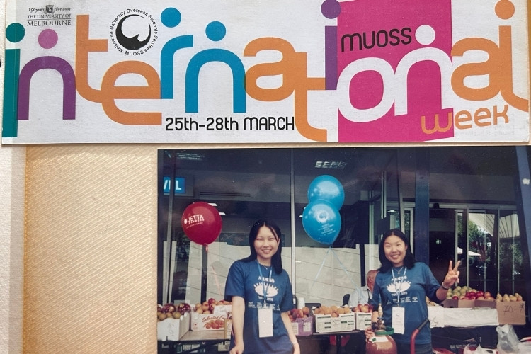 Two girls behind a counter at an event