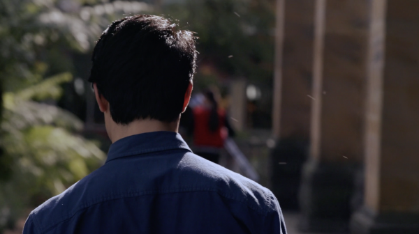 The back of a student's head as they walk around campus.
