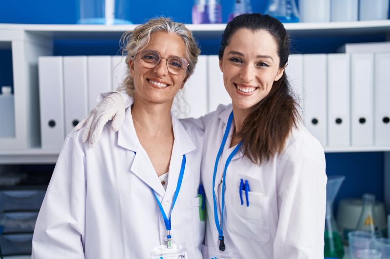 Two women of science in a lab environment 