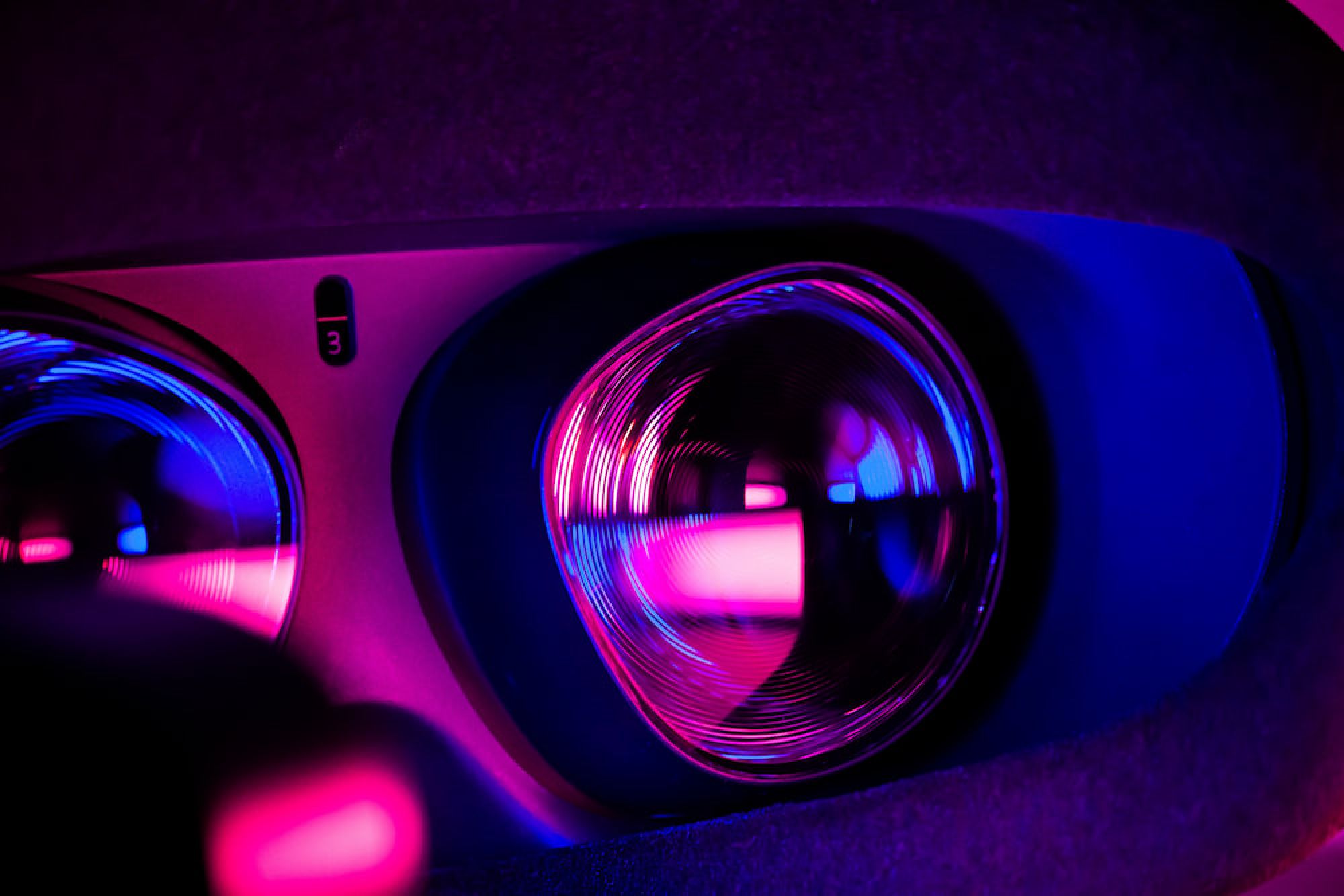 An up close image of a person wearing a virtual reality headset.