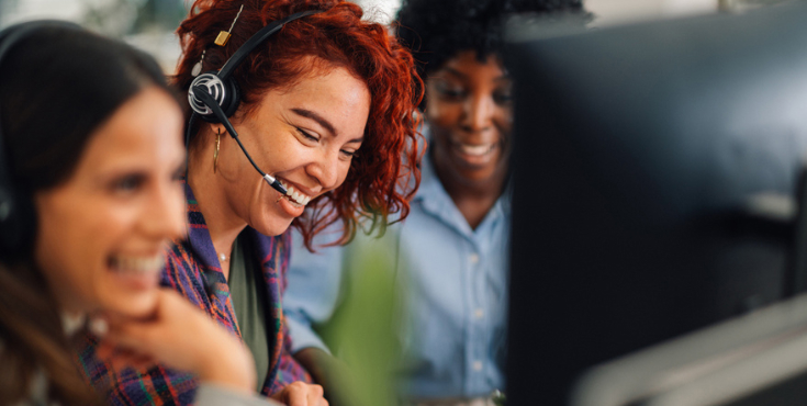 A support team in a call centre on call with potential donors.