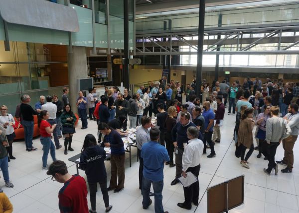 Bio21 Atrium with an event running and many people milling around talking.