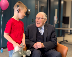 Professor Graeme Clark AC and Hudson at the Royal Victorian Eye and Ear Hospital.