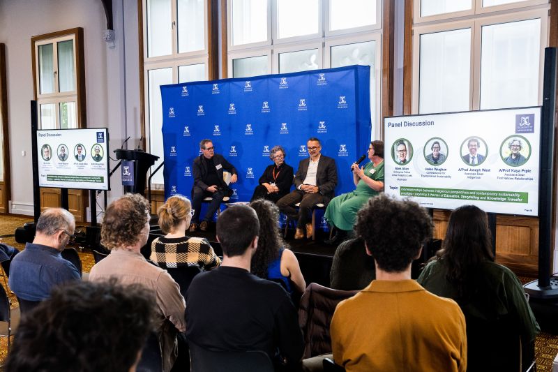 Panel discussion taking place in front of an audience