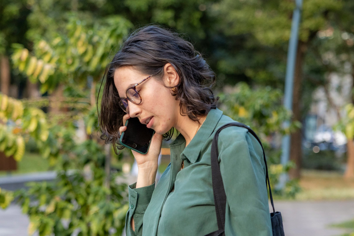 A photo of someone talking on the phone