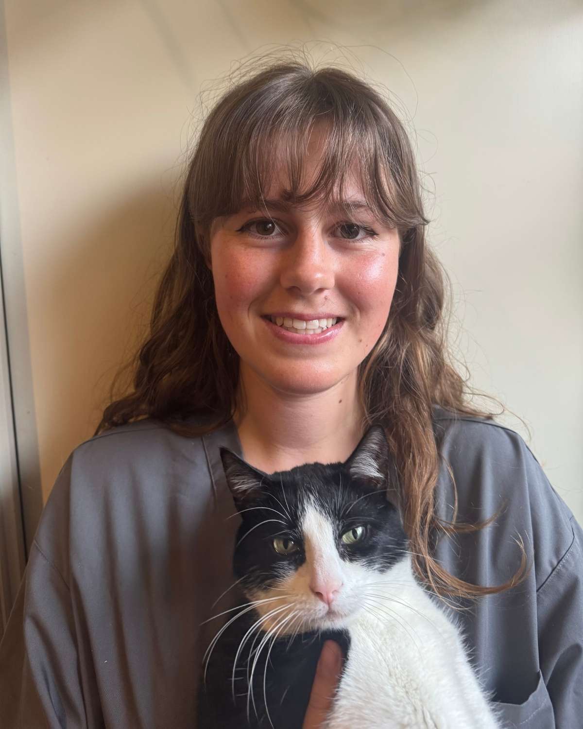 Emmanuelle holding her disabled cat, Bug