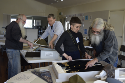 Conservation staff talk to community members about their collections