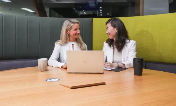 Rachel giving her mentee, Jo, advice on her CV during one of their coffee catch ups.