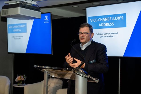 Vice-Chancellor Professor Duncan Maskell speaking at a podium.