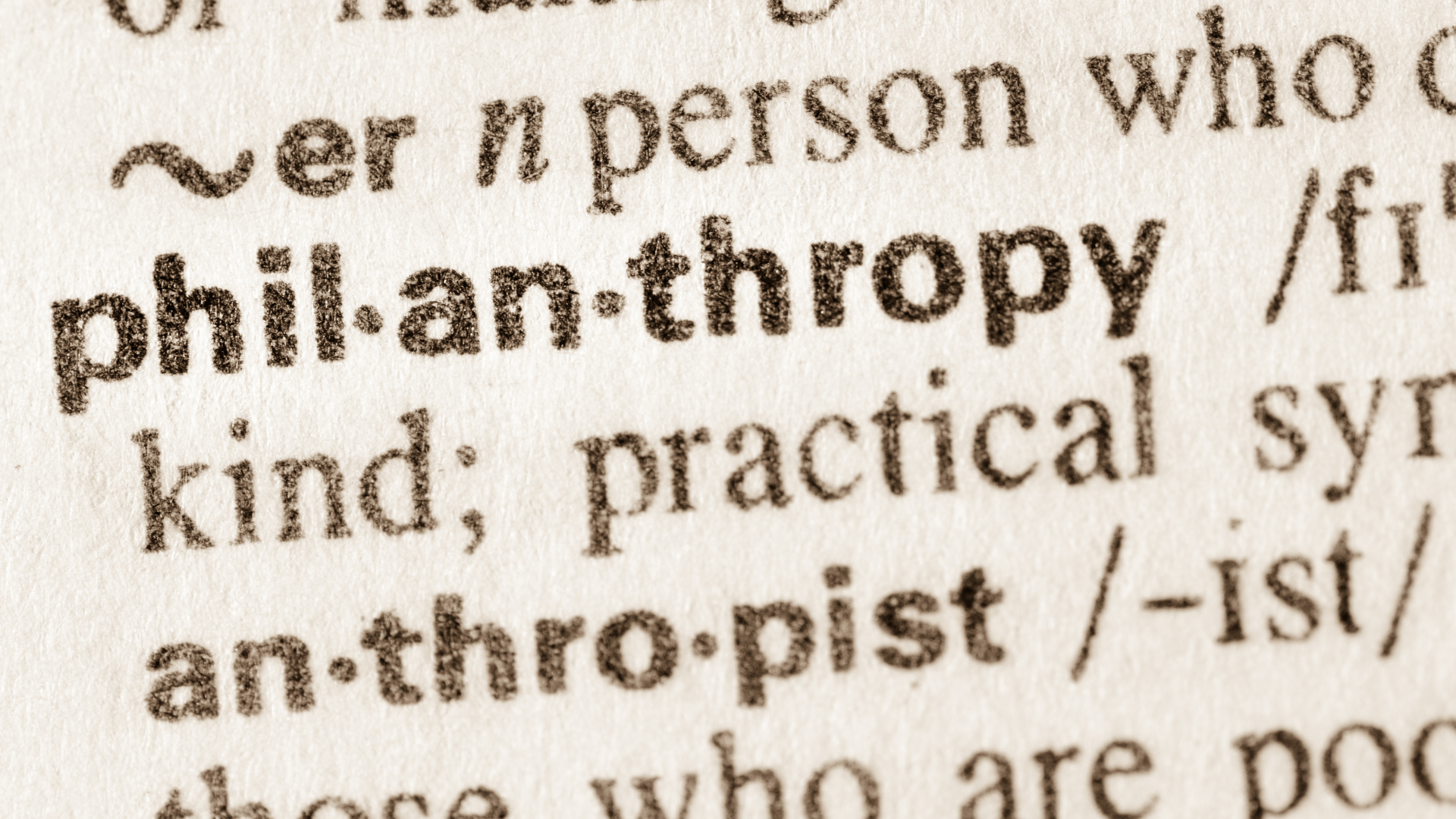 A close up of the word Philanthropy in a dictionary.