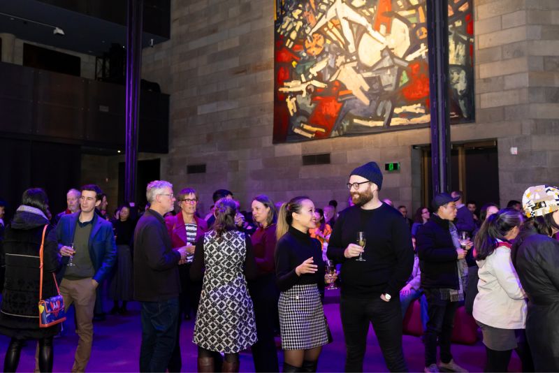 Volunteers and their invited guests mingling at the volunteer thank you event.