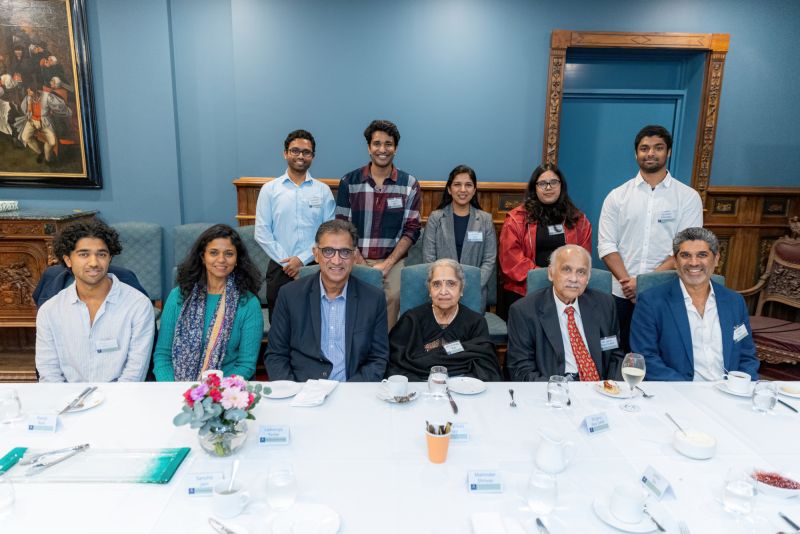 The Rao family and previous bursary recipients enjoying an afternoon tea together in May 2024.