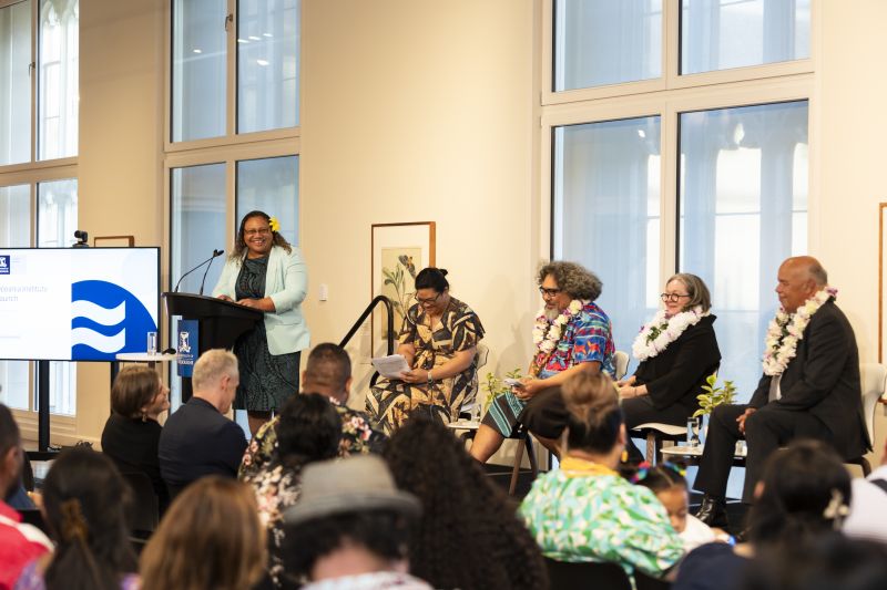 Five panellists at the Oceania Institute launch sitting on the stage listening to community leader Emma Kamupala