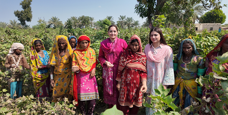 Zarqa (centre) in the cotton fields with the women who power Pakistan's agricultural backbone.