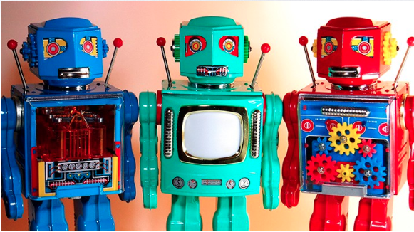 Image of three colourful toy robots.