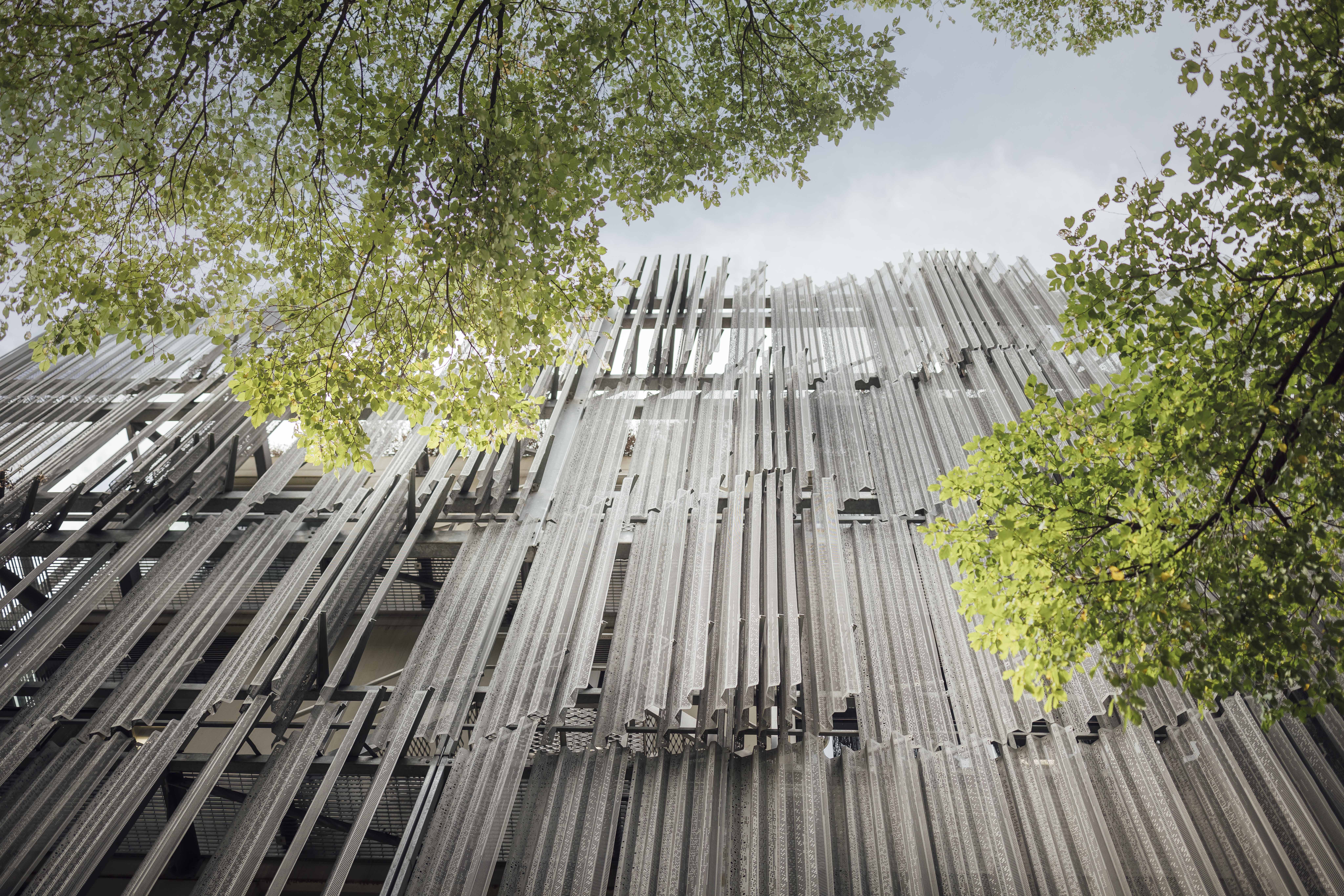 Melbourne Design School façade with vertical metal fins and surrounding trees