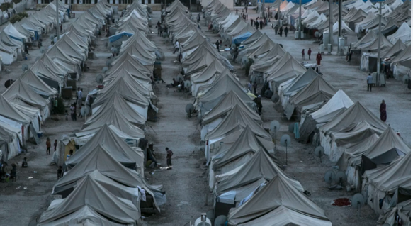 Image of rows of tents in a refugee camp.