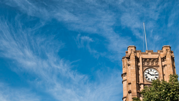 Image of the Old Arts Clock Tower in the University of Melbourne Parkville campus.