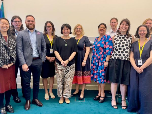 Researchers and policy-makers psoing for a photo.