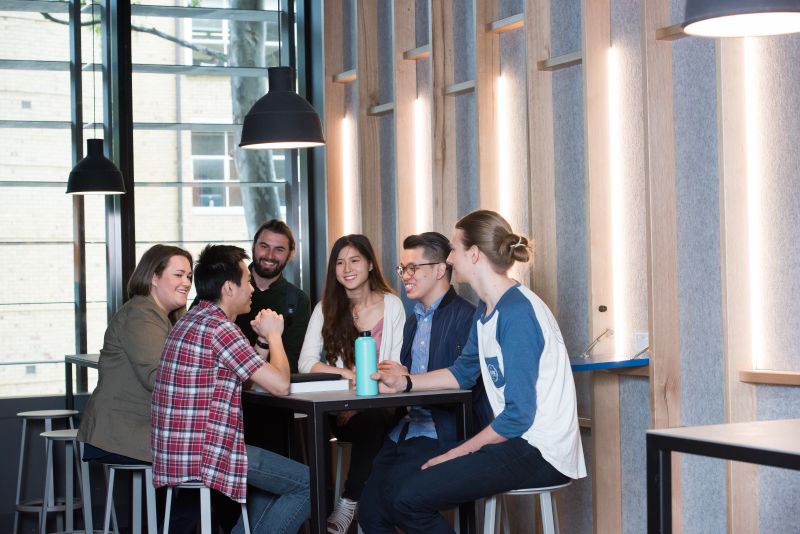 A table of students play trivia