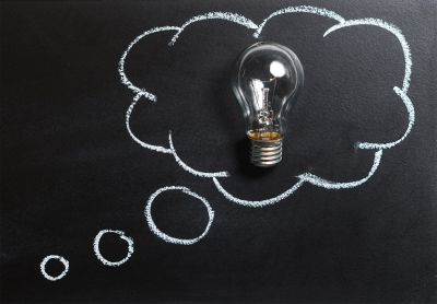 Blackboard with a speech bubble and lightbulb 