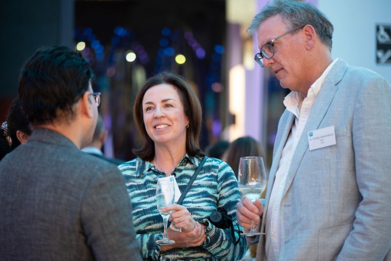 Dental alum Renae Welsh (centre) talking with fellow alumni.