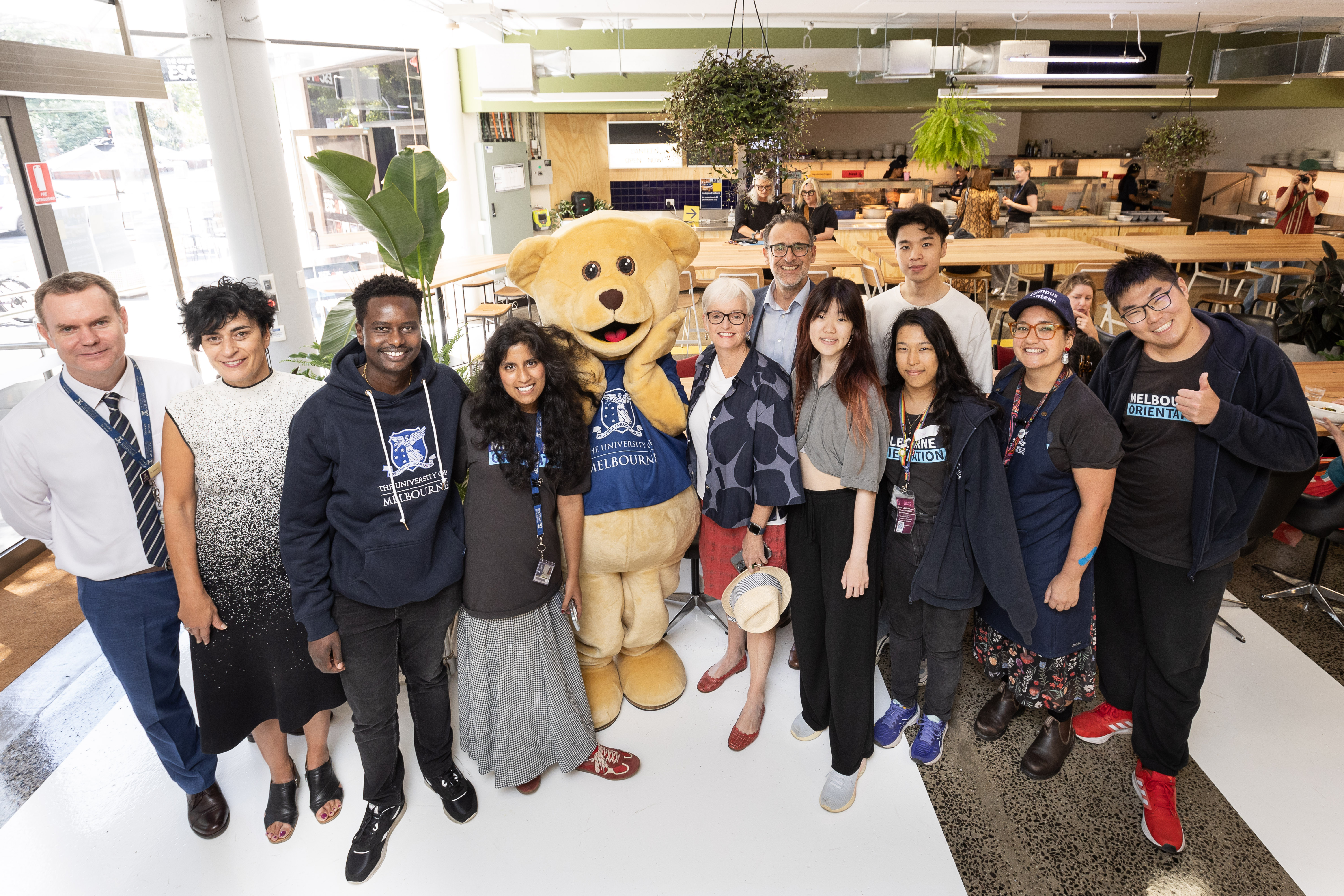 Professor Johnston, staff, students and Barry the Bear at the opening of the Campus Canteen. Picture: Peter Casamento