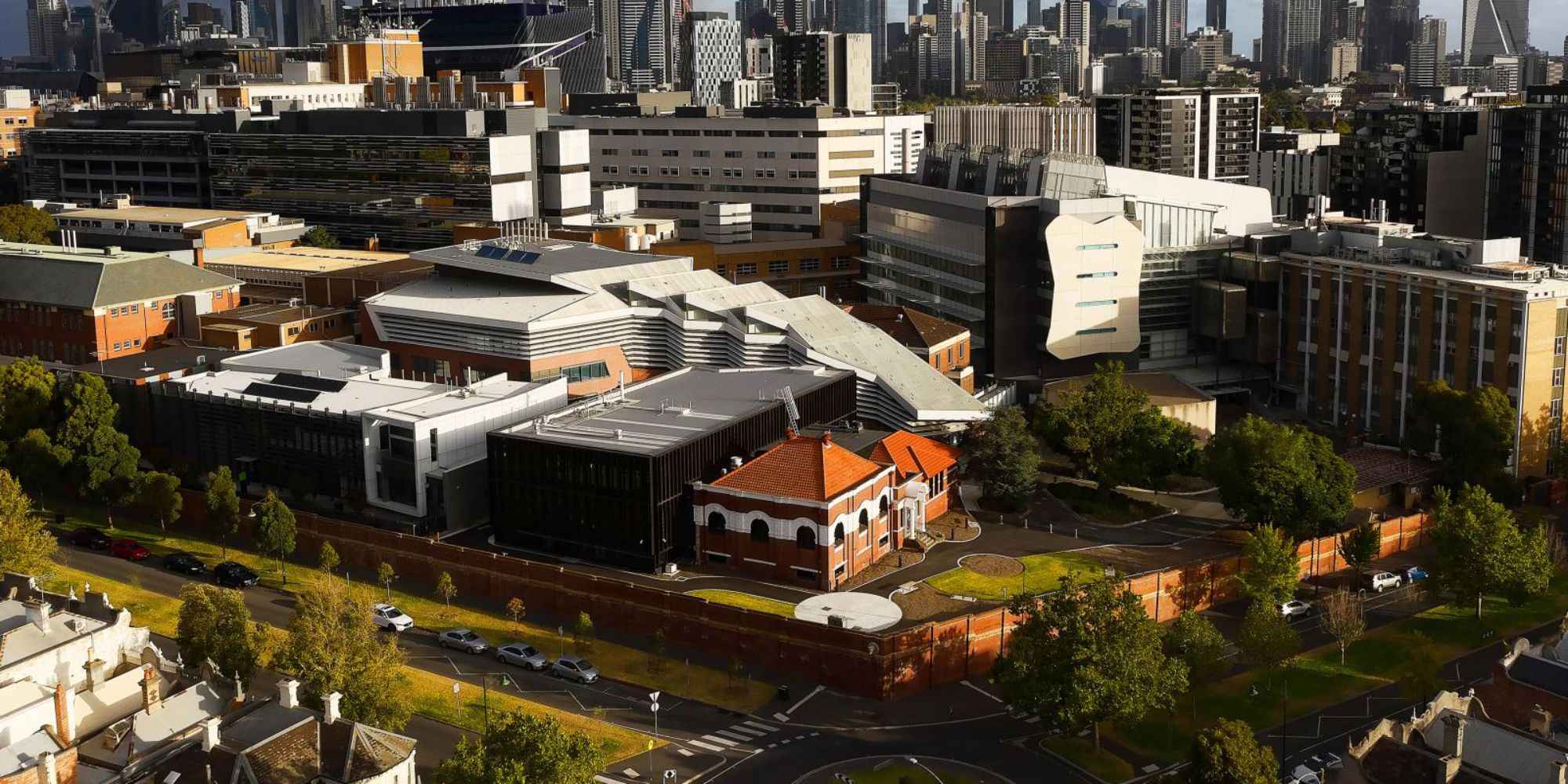 View over Bio21 buildings looking toward the Melbourne city skyline.