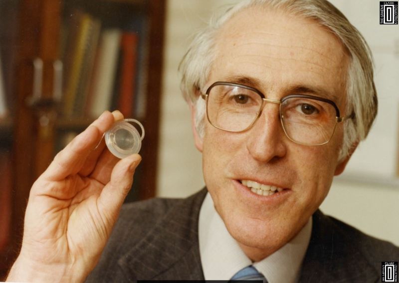 Graeme Clark in his office in 1985 with the Cochlear Limited CI22 implant he and Brian Pyman implanted in Graham Carrick in 1982 at the RVEEH.