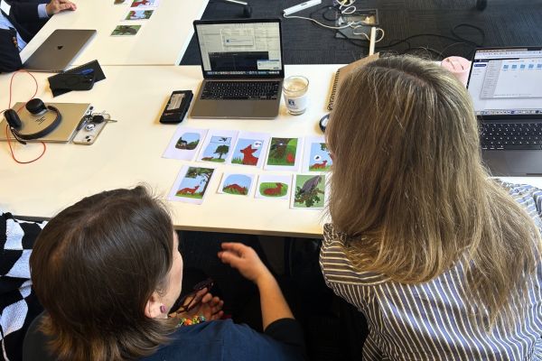 Editing-2.jpg Two people look over visual cue cards to help with their storytelling.