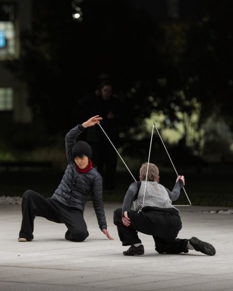 Two people exploring movement during a performance