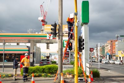 Image of sensors being installed at a busy intersection.