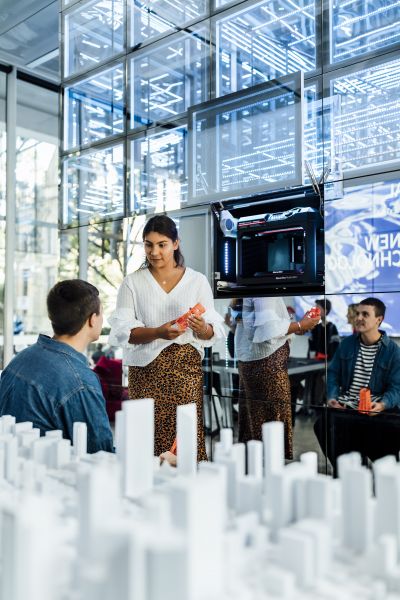 People in Next Lab talking about a building model.