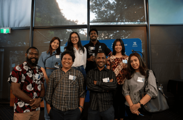 A group of four participants of the Welcome to Melbourne program smiling to camera.