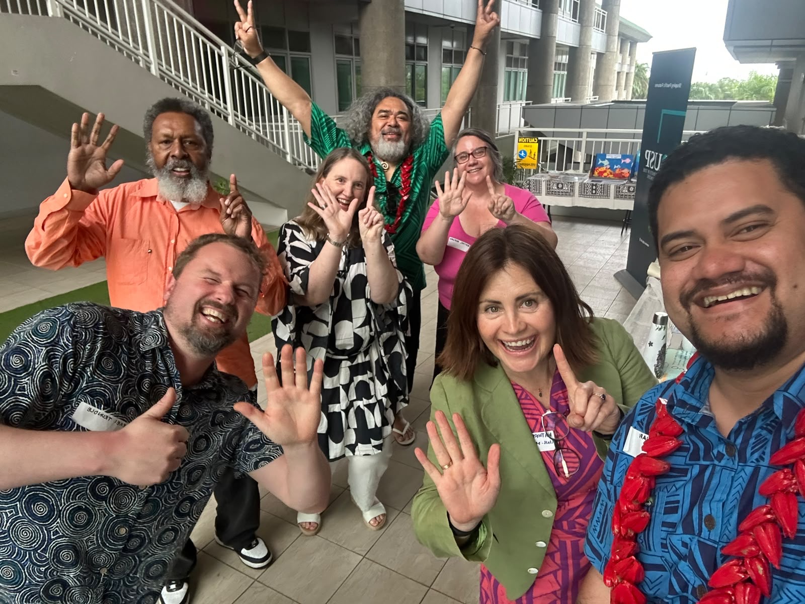 University of Melbourne delegates at Pacific Climate Week in Fiji use a "1.5" hand gesture to highlight the importance of keeping the 1.5&deg;C climate target within reach ahead of COP31 and future global climate negotiations.