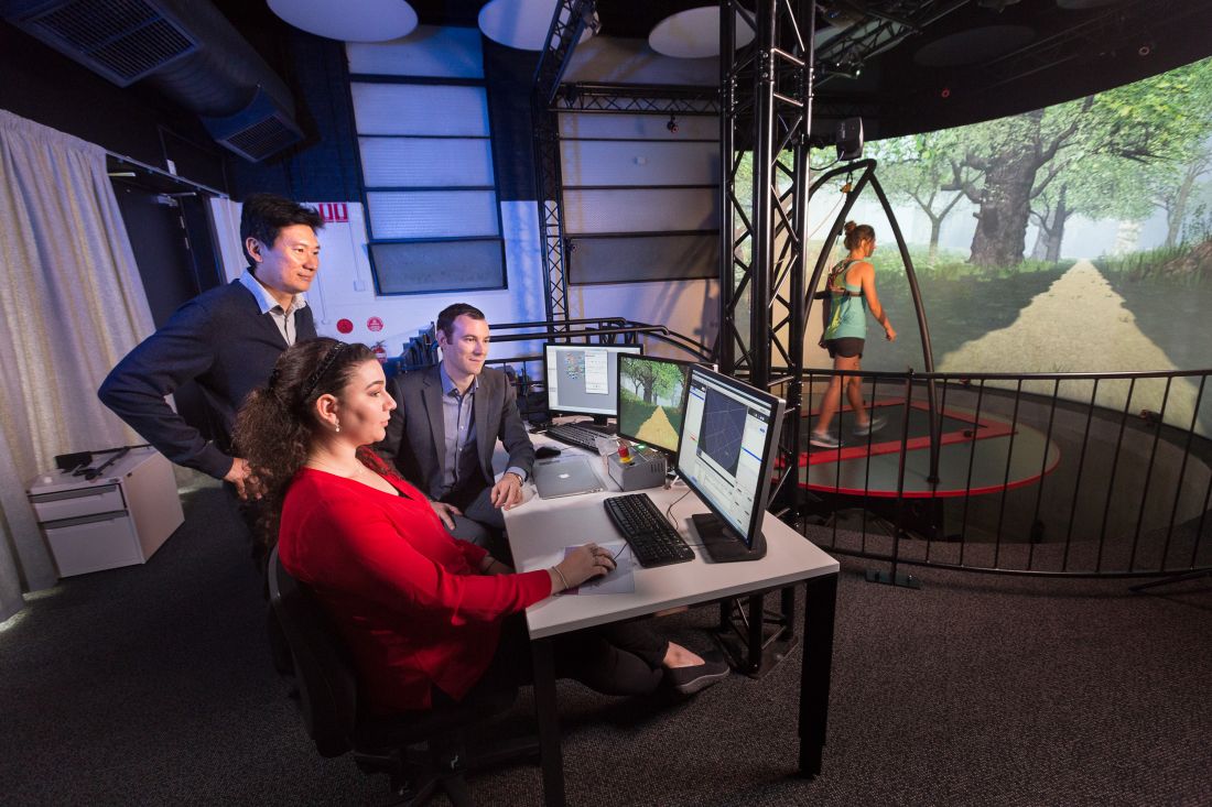 Researchers using the Computer Assisted Rehabilitation Environment (CAREN)