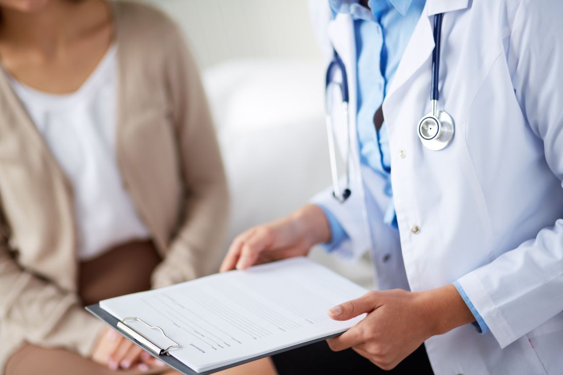 Image of a doctor counselling a female patient.