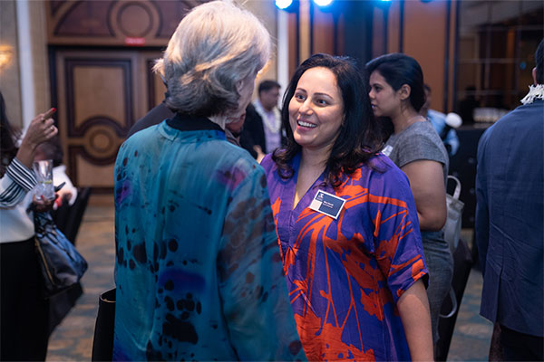 Ritu David speaking with Head of Post, Consulate-General in Mumbai Majell Hind.