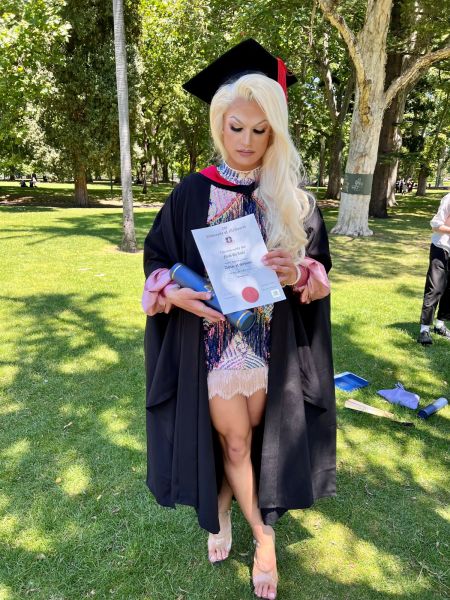 Noah graduating in drag in 2023.
