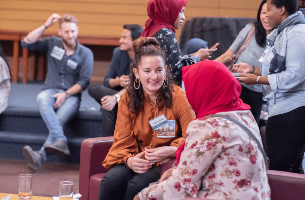A Welcome to Melbourne student talking with their alumni volunteer.