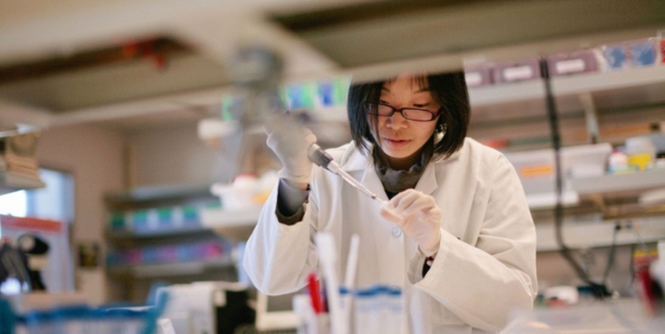 A lab researcher running tests in a research lab.