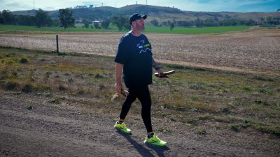 Travis Lovett on Day 12 of the Walk for Truth, approaching University of Melbourne's Dookie Campus. Image: Jordan Ross