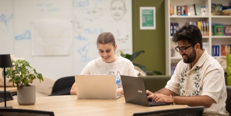 Two students studying at a table