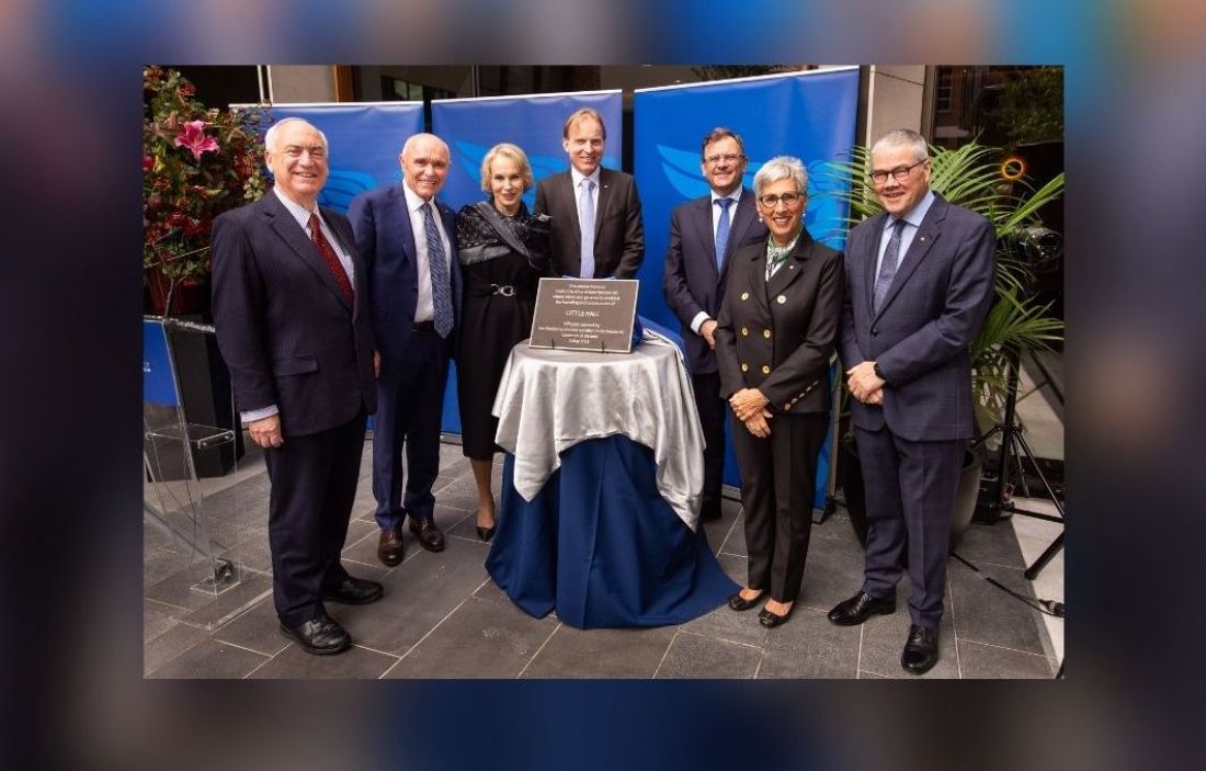 Image of dignitaries with Little Hall plaque.