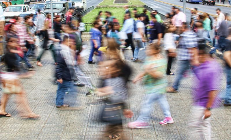 People walking across a road