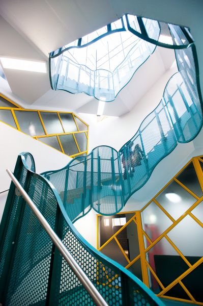 Blue and yellow spiral staircase.